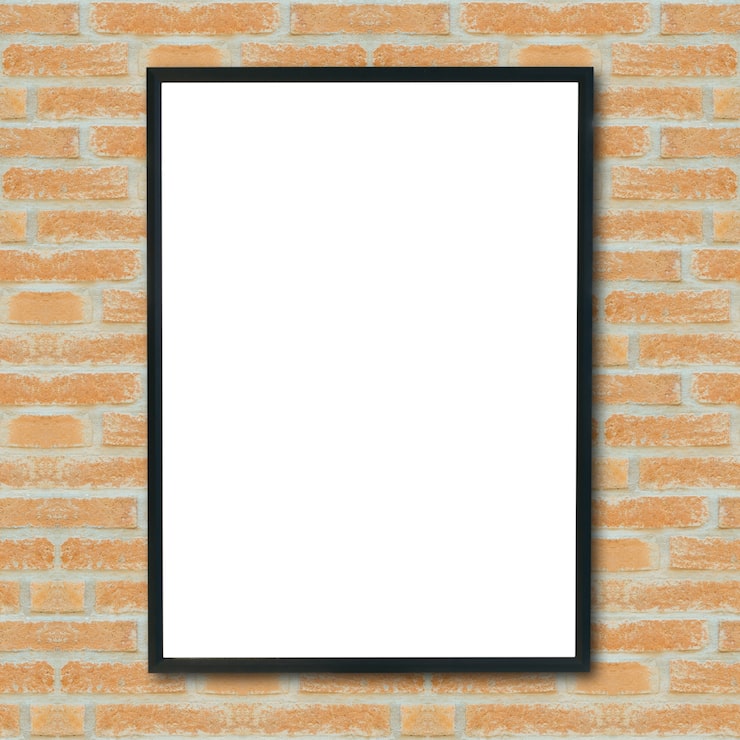 Photo Gratis mockup bingkai gambar poster kosong di dinding bata.