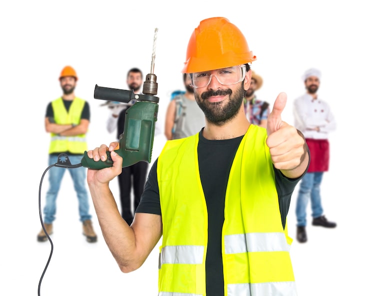Gratis Foto arbeider med drill over hvit bakgrunn
