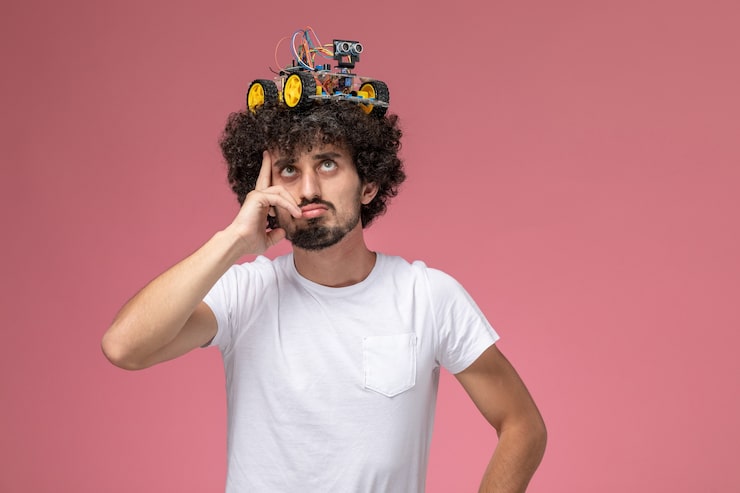 Gratis Foto forfra ung mann som setter elektronisk innovasjon på hodet og tenker