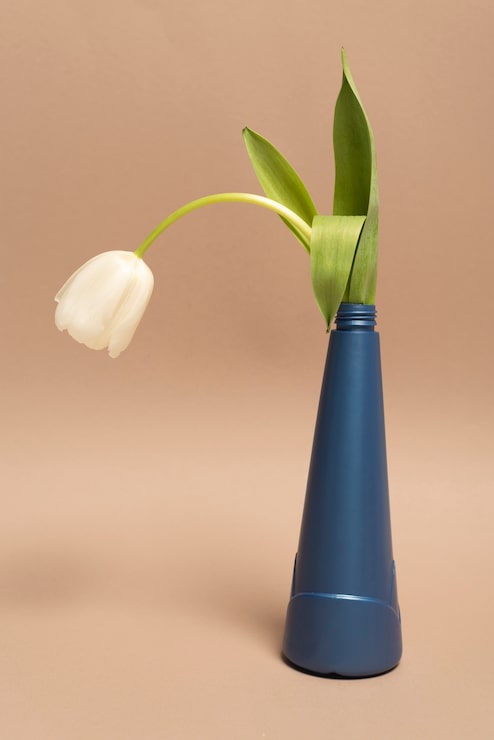 Gratis Foto gjenbrukbar plastflaske med blomst
