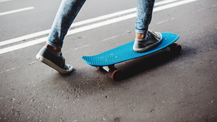 Gratis Bild ben på en skateboard