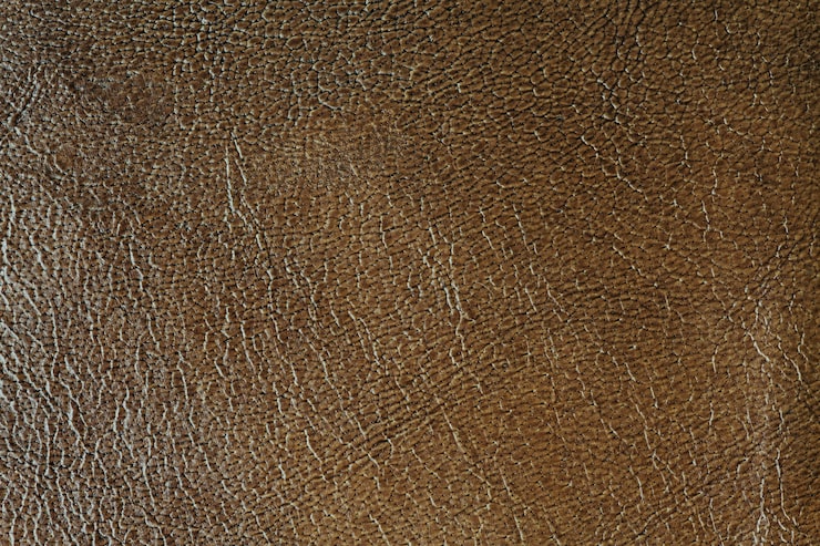 Gratis Bild mörkbrun lädertexturerad bakgrund