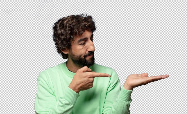 PSD gratuito sonriendo sintiéndose feliz despreocupado y satisfecho señalando el concepto o idea en el espacio de copia en el lado