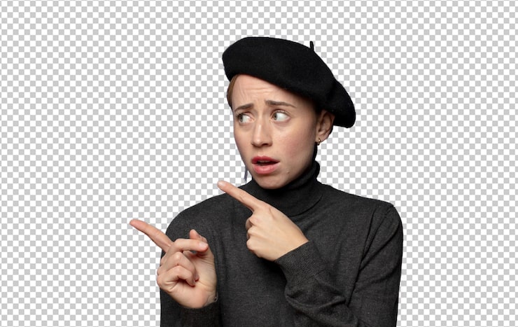 PSD gratuit se sentant choqué et surpris pointant vers l'espace de copie sur le côté avec le regard étonné de la bouche ouverte