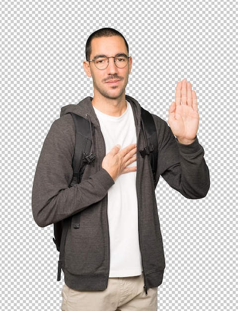 PSD étudiant sérieux avec un geste de serment