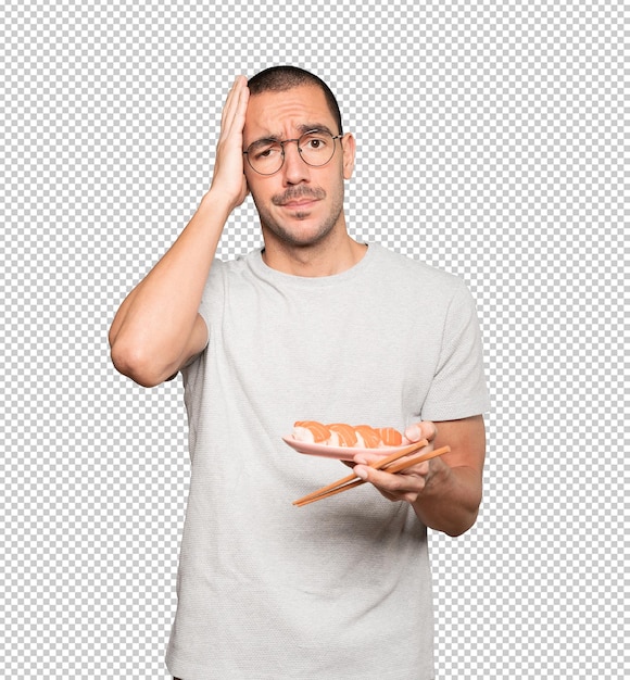 PSD joven con palillos para comer sushi