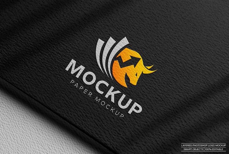 PSD maqueta de logo sobre papel negro texturizado